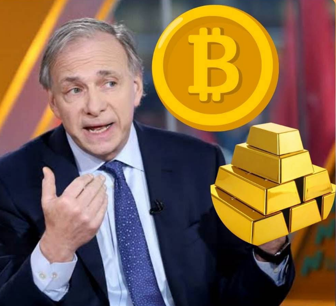 A man in a suit and blue tie appears to be speaking, with a Bitcoin logo and gold bars overlaid on the image.