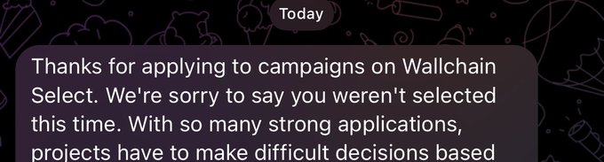 The image shows a text message from Wallchain, which reads "Today thanks for applying to campaigns on Wallchain Select. We're sorry to say you weren't selected this time. With so many strong applications, projects have to make difficult decisions based on..." The message is written in a casual tone and includes an image of a cake with the words "Wallchain just choosed to raigebait washed kols Make Una no vex".