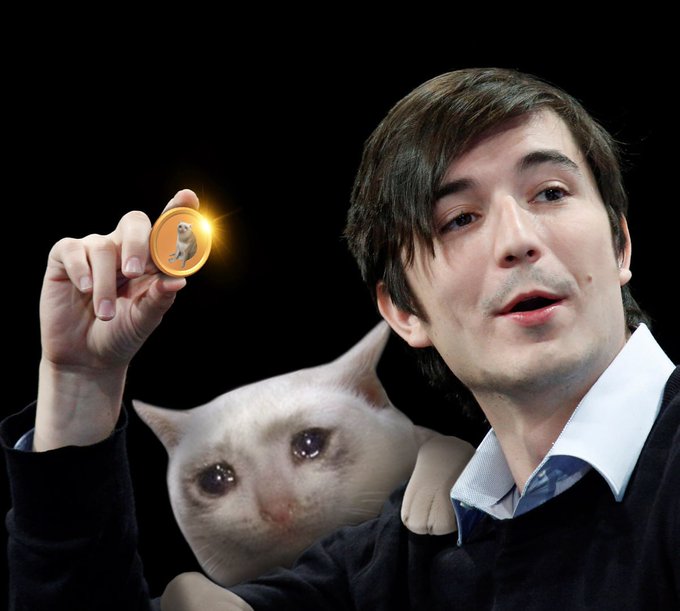 A man proudly holds up a Dogecoin token next to his white cat, symbolizing round-the-clock crypto enthusiasm—aligning with the "24/7/365" tagline by highlighting how Dogecoin traders like those on Robinhood Crypto are always ready to engage with their favorite meme-inspired digital asset.