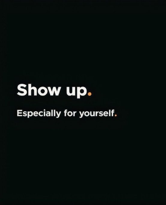 A black motivational poster with white and orange text reading 'Show up. Especially for yourself.'