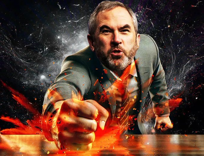 urn of fire burns on a table, with a man's face and hands in the foreground, set against a black background speckled with orange and white sparks.