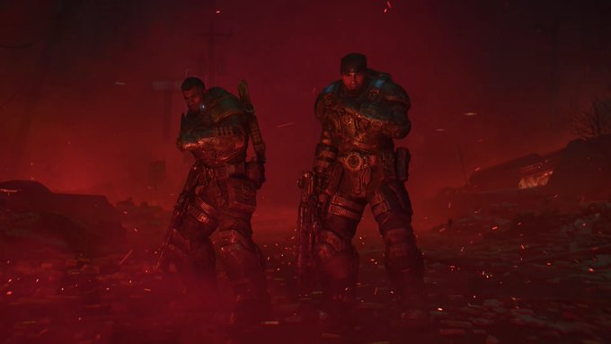 Two armored soldiers standing in a dark, red-lit battlefield with embers floating in the air.