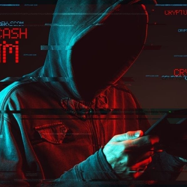 A hooded figure uses a phone with red and cyan cyberpunk glitch effects and crypto-themed text overlays in the background.