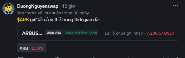 A screenshot of a trading post by 'DuongNguyenswap' featuring a top trader profit ranking, ARB token down -2.39%, and a long position showing an unrealized loss of -7,236.54 USDT.