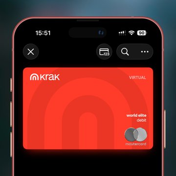 The image shows an iPhone displaying a digital Mastercard from Krak (Kraken's neobank), labeled "VIRTUAL" and "world elite debit," aligning with the post's point about Krak being an onchain neobank offering cards, IBANs, and salary payments as part of Payward's broader financial ecosystem.