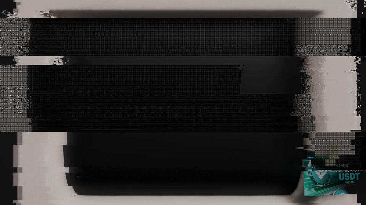 The image shows a black and white photo of a computer screen with the text "USDT" written on it, which appears to be related to the USDT coin. The background of the image is gray, providing a neutral backdrop that allows the focus to remain on the content displayed.