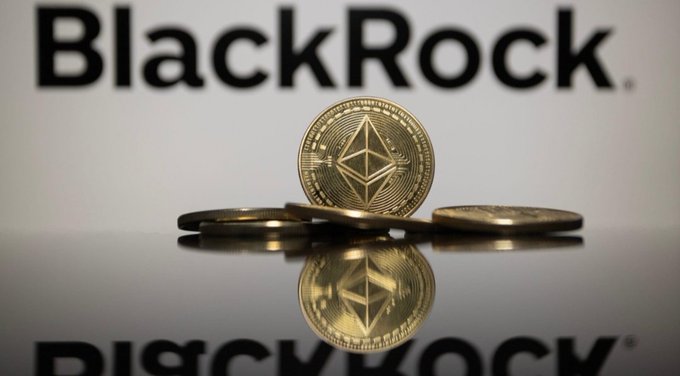 The image features physical representations of Ethereum coins arranged in front of the "BlackRock" logo, with the coins' reflections visible on the glossy surface below. The composition visually reinforces the post's message about BlackRock's growing institutional investment in Ethereum, linking the asset management giant directly to the cryptocurrency through its iconic diamond-shaped logo.