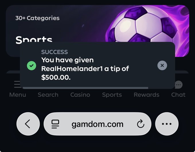 A success notification on gamdom.com confirming a $500.00 tip given to user RealHomelander1, displayed over a purple sports betting interface.
