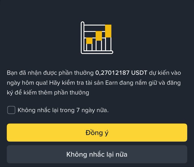A Binance Earn notification in Vietnamese confirms a reward of 0.27012187 USDT, with options to acknowledge ("Đồng ý") or dismiss ("Không nhắc lại nữa"), illustrating the modest daily passive income from staking mentioned in the post.