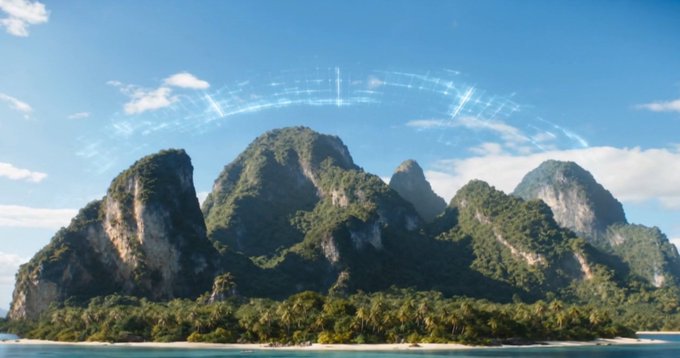 A tropical island with dramatic limestone cliffs sits beneath a glowing, futuristic blue dome that arches across the sky like a protective shield. The sci-fi overlay reinforces the post's optimistic tone, framing "a glorious day" as if the island is being celebrated or shielded under a serene, otherworldly sky.