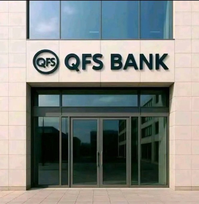 The glass entrance of a bank features a prominent sign reading 'QFS BANK' mounted on a light stone facade.