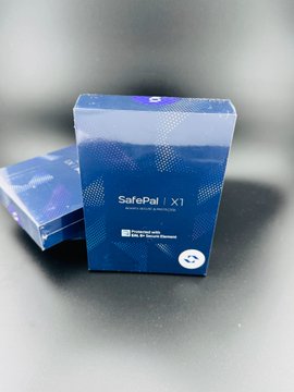 A blue SafePal X1 hardware wallet box is displayed on a gray surface, matching the product being sold by the poster. The packaging clearly shows the "SafePal X1" branding and notes it as a "Universal Crypto Wallet."