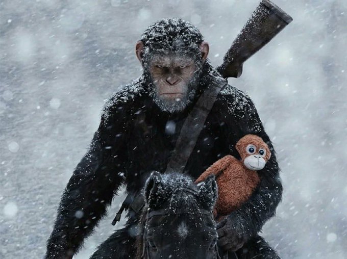 An ape covered in snow rides a horse through a snowstorm while carrying a rifle and holding a small brown stuffed monkey toy.