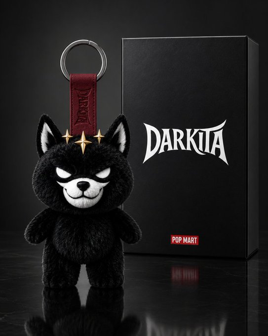 A black plush keychain figure with a devilish grin, sharp ears, and gold star accents hangs from a metal ring, displayed next to a sleek black box branded with the "DARKITA" logo and a "POP MART" tag. The image showcases the Darkita collection, presented as the first 10K Bitcoin-inscribed PFP series on Ethereum, tying into the promotional post directing viewers to mint via their EVM wallet.