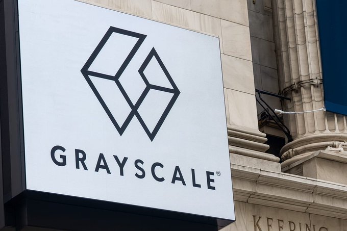 A sign displays the Grayscale logo and name, representing the company that is reportedly moving $54 million in Bitcoin amid investor withdrawals.