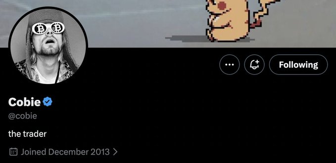 A Twitter/X profile for 'Cobie' (@cobie), verified account, with the bio 'the trader', joined December 2013, featuring a black-and-white photo of a man wearing Bitcoin sunglasses and a pixel art dinosaur as the banner.