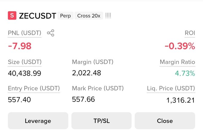 A short position on ZEC/USDT perpetual futures with 20x cross leverage, showing an unrealized loss of -7.98 USDT (-0.39% ROI) at an entry price of 557.40 and current mark price of 557.66. The image illustrates the active trade with a low margin ratio of 4.73%, far from the liquidation price of 1,316.21.