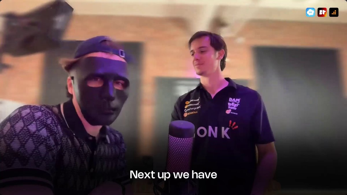 The image shows two men wearing masks, one of which has black hair, standing next to each other with a microphone. The text in the image reads "Definitely not perfect but @MetaDAOProject still moggs (literally raised 10x more than competitors) I'm genuinely curious about the calculations on why the performance package can't be more than 50% And in case a team wants to expand the package would the markets actually be". The image is a screenshot of a post where two people are standing with their masks and holding a microphone. There's also an explanation provided for the text present in the image, which states that the team's performance can't reach 50%.