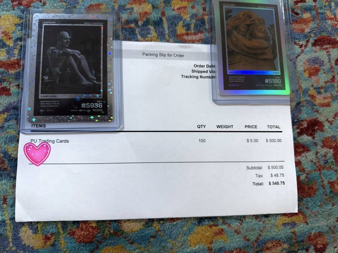 The image shows two trading cards sitting side by side on top of a colorful rug or carpet. The cards are black and white with images of people on them. One card has a pink heart sticker on it, while the other does not have any stickers. The text in the image reads "Packaging for unordered items at $35.95", indicating that these trading cards were purchased for $35.95. The post also mentions that the person who bought these cards spent $500 on them and is about to cash out for $40,000.