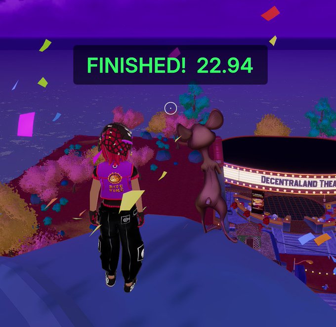 A screenshot from Decentraland showing an avatar in a 'PIECE FIGHT' shirt standing next to a gray mouse-like figure, with 'FINISHED! 22.94' displayed and 'DECENTRALAND THEATER' visible below.
