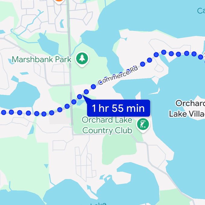 A map screenshot shows a walking route of 1 hour 55 minutes along Commerce Rd, passing near Marshbank Park and Orchard Lake Country Club. The route length aligns with the post's surprise at earning roughly 23 energy tokens for what felt like a shorter walk than expected.