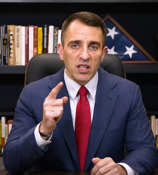 Anthony Pompliano, a prominent Bitcoin advocate and investor, speaks passionately while pointing his finger, likely during a video commentary where he predicts that AI investment profits will eventually flow back into Bitcoin and gold.