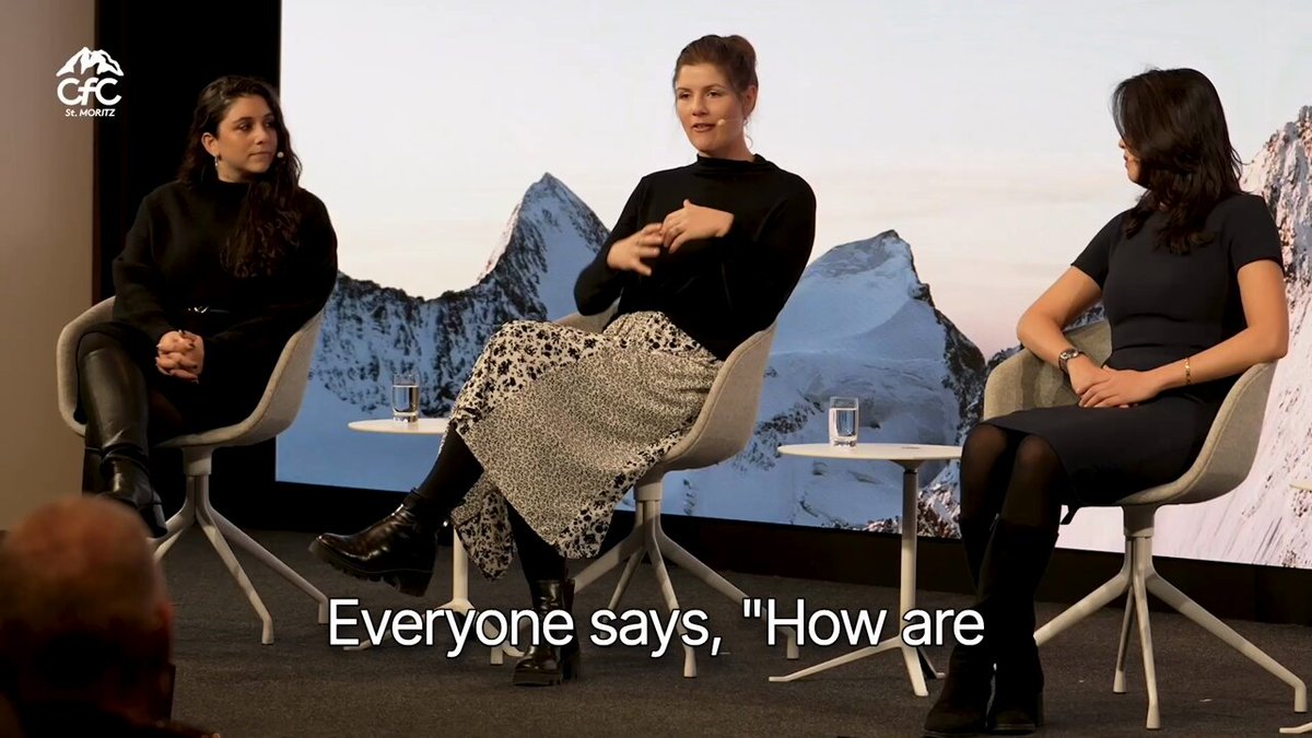 The image shows three women sitting around a table with chairs, engaged in conversation. The background features a large screen displaying text related to Centrifuge's work since 2017. The caption for the image reads "Real-world assets get genuinely powerful once they're liquid and usable onchain. @itsbhaji at CFCstmoritz on what Centrifuge has built since 2017: bring great assets onchain, make the onchain version better than offchain, and draw in a new wave of capital."
