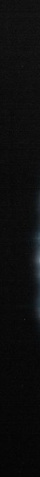 A mostly black screen with a faint vertical light streak in the center.