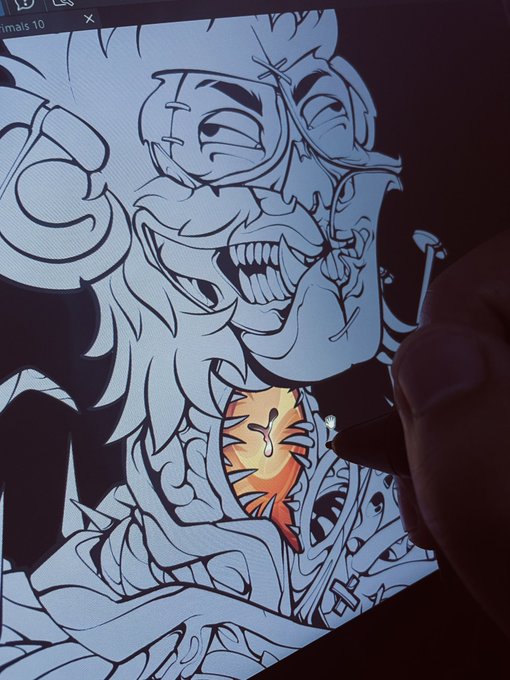 A digital artist using a stylus to color a spooky, grinning skull-faced character with a heart in its chest on a drawing tablet screen.