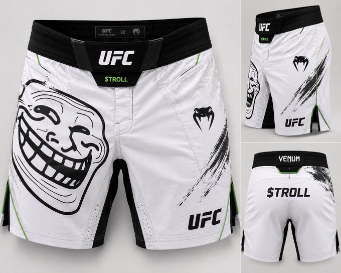 These are white Venum UFC fight shorts, size 32, featuring a "STROLL" name on the waistband and a large troll face graphic on the left leg, with the fighter's name "$TROLL" displayed across the back, tying into the meme-style "$troll the planet" branding.