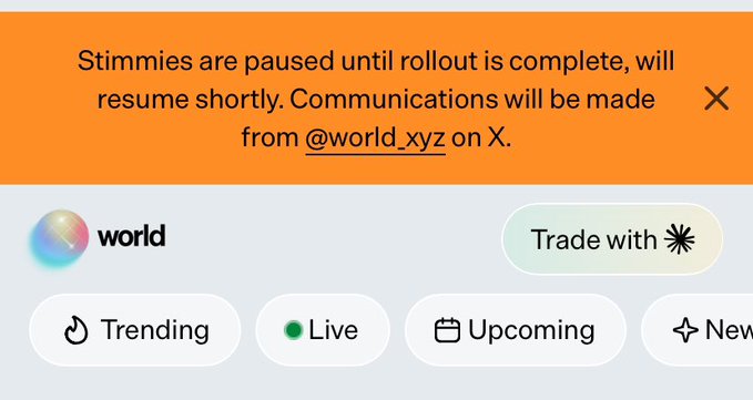 Worldcoin app notification stating 'Stimmies are paused until rollout is complete, will resume shortly. Communications will be made from @world_xyz on X.'