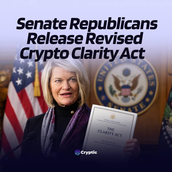 The image shows Senator Cynthia Lummis holding a copy of "The Clarity Act: A Framework for Digital Asset Market Structure" at a podium with the U.S. Senate seal and American flag behind her, with a headline announcing "Senate Republicans Release Revised Crypto Clarity Act" and a "Cryptic" watermark at the bottom. This visual accompanies the post about Republicans unveiling an updated Clarity Act with new provisions for non-decentralized finance protocols ahead of the September 15 vote.