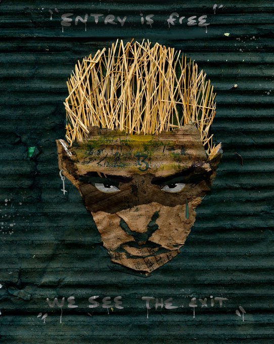 A stylized illustration features a face made of cardboard and debris with spiky straw for hair, with the text 'ENTRY IS FREE' above and 'WE SEE THE EXIT' below.