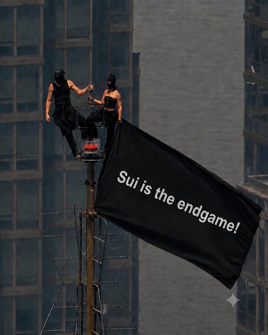 Two masked performers perched atop a high-rise pole unfurl a large black banner reading **"Sui is the endgame!"**, visually amplifying the post's bullish case for $SUI by dramatizing its institutional milestones (3 spot ETFs and CME listing) as a decisive, final triumph for SuiNetwork.