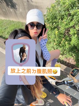 A woman in a white cap and sunglasses poses with a peace sign on an outdoor scooter, with a sticker overlay reading "放上之前勿腹肌照" (roughly "abs photo before posting") referencing toned abs, fitting the post's theme of athletes training for their personal "Olympics" thanks to crypto exchange sponsors like @binancezh, @Gate, @MEXCZH, @bitunix, @Bitget_zh, and @okxchinese.