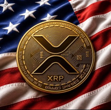 A physical gold-colored XRP cryptocurrency coin rests on a waving United States flag.