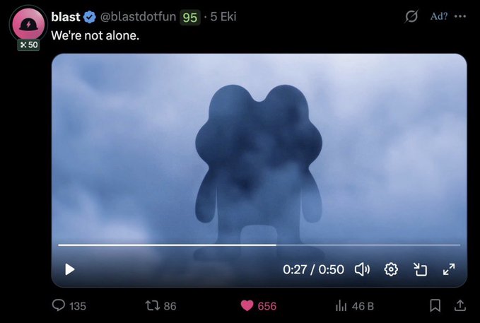 A Blast social media post reads “We’re not alone.” and displays a blue-toned video of a rounded cartoon-like figure seen through mist, with the player showing “0:27 / 0:50.”