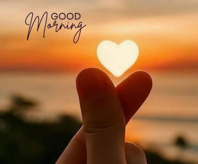 A photograph shows a hand forming a heart shape against a sunset over the ocean, with the text "GOOD Morning" written above.