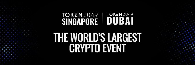 A black and blue banner advertising 'TOKEN2049 SINGAPORE | TOKEN2049 DUBAI' as 'THE WORLD'S LARGEST CRYPTO EVENT'.