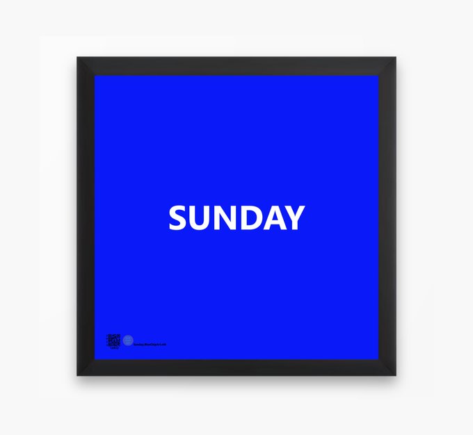 A blue framed poster with white text reading 'SUNDAY' in the center and small logos at the bottom left.