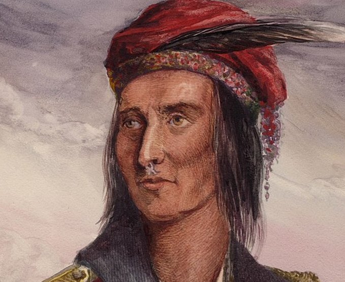 A detailed portrait depicts Tecumseh, the Shawnee leader, wearing a red turban adorned with feathers and decorative beads against a cloudy sky. The image illustrates the post's message about unity, as Tecumseh was renowned for uniting Native American tribes across cultural and tribal lines, serving as a powerful symbol of bringing communities together despite differences.