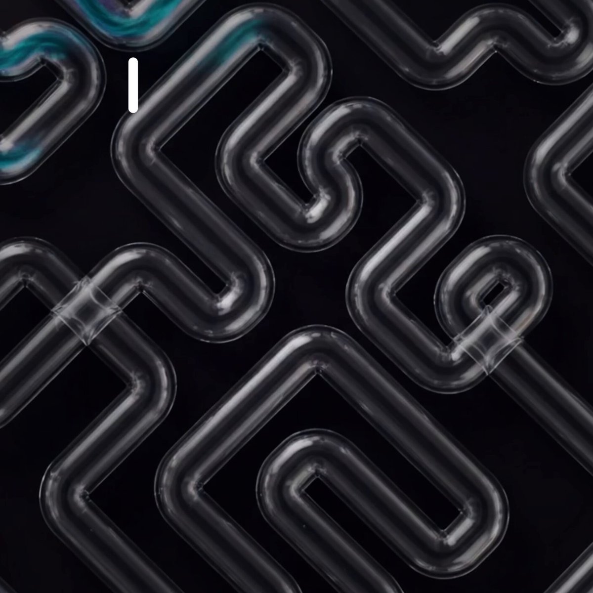 The image features a black background with a maze of transparent pipes arranged in a complex pattern. The pipes are curved and appear to be made of glass or plastic material. The arrangement of these pipes creates an intricate design, which adds visual interest to the scene. The image also contains text that reads "AIOZ Stream brings peer-to-peer media delivery through distributed contribution across AIOZ DePIN". This text provides context about the content and source of the image, suggesting it is related to a discussion or exploration of the maze-like structure created by the transparent pipes.