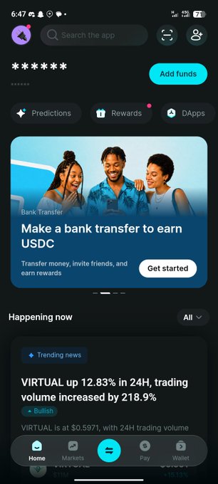 A mobile app screenshot of a crypto/web3 platform featuring a 'Bank Transfer' promotion to earn USDC and a trending news card stating 'VIRTUAL up 12.83% in 24H'.