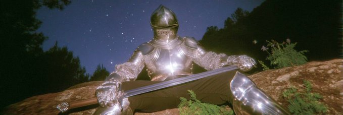 A knight in shining armor lies reclined against a stone ledge beneath a starry night sky, clutching a large sword in a moment of rest. The medieval imagery mirrors the "$Knight" token reference in the post, evoking themes of valor and chivalry associated with the cryptocurrency.