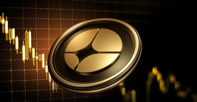 A close-up image of the XRP coin set against a golden background featuring a financial trading chart with candlestick patterns.