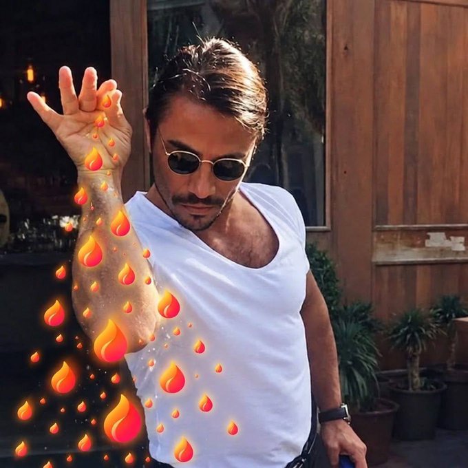 A man in a white tank top and sunglasses poses with his arm raised, surrounded by a digital fire emoji effect cascading down his arm, playing on the "ember season" ($EMBER) theme referenced in the post about Solana's 5th largest launchpad milestone.
