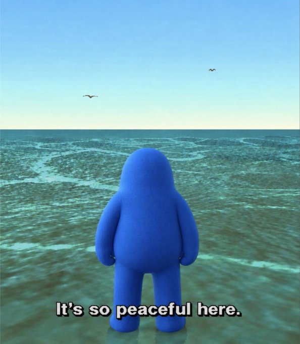A blue 3D character stands facing the ocean under a clear sky with two birds, accompanied by the text 'It's so peaceful here.'
