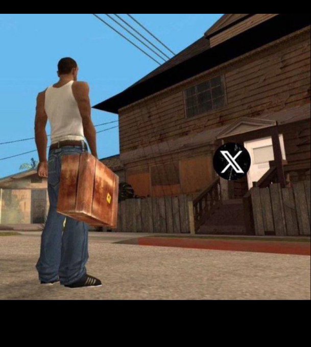 Video game screenshot (GTA: San Andreas style) showing a character in a white tank top and jeans holding a brown suitcase outside a wooden house, with an X/Twitter logo overlay.