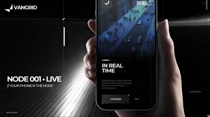 A dark promotional image showing a hand holding a smartphone with 'VANGRID' branding, displaying 'NODE 001 - LIVE' and 'YOUR PHONE IS THE NODE' alongside an 'IN REAL TIME' surveillance-style feed on the screen.