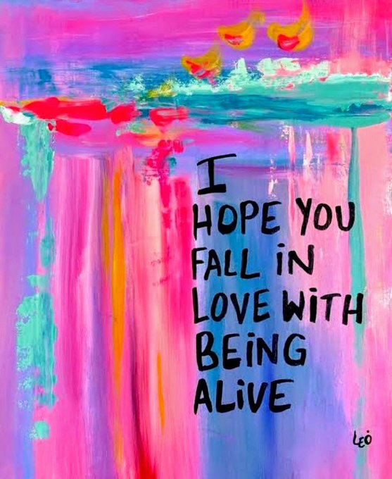 A vibrant, colorful abstract painting with pink, blue, and yellow brushstrokes featuring the text: 'I HOPE YOU FALL IN LOVE WITH BEING ALIVE', signed 'LEO'.
